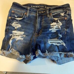 American Eagle Next Level Stretch High Rise Shortie Shorts. Denim. Woman size 0